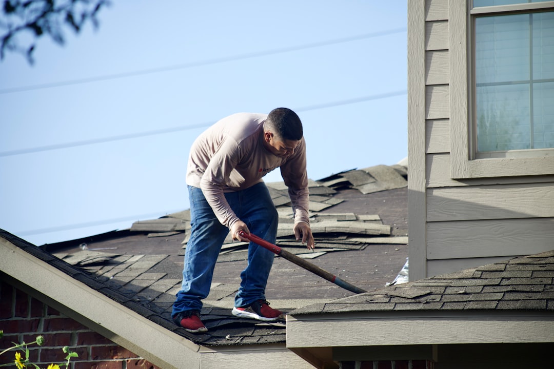 roof damage inspection, contractor checking roof